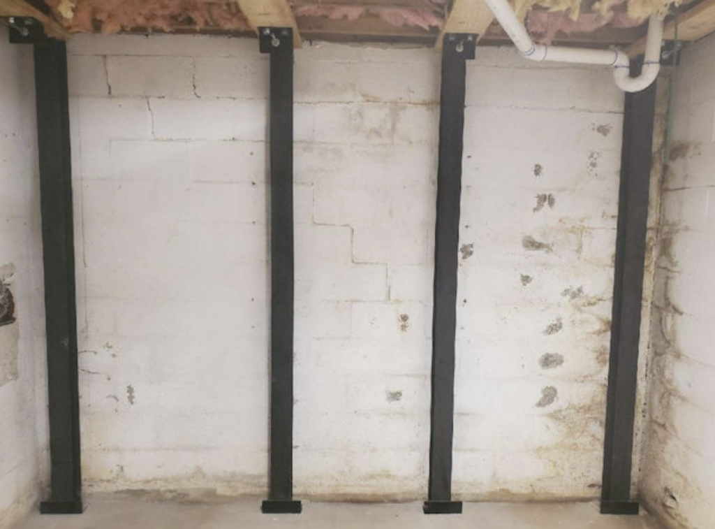 foundational repair Force Beam Support System to stabilize a basement wall on a home in the Upstate of South Carolina.